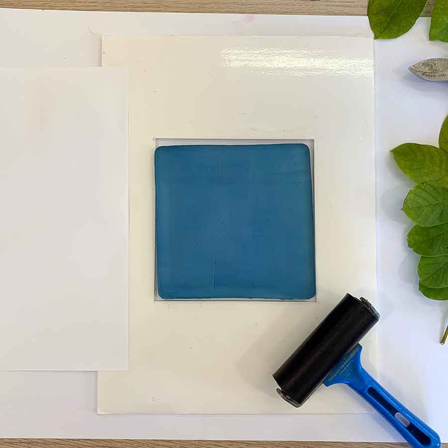 Gel print with a white silhouette - step 1 - ink the plate