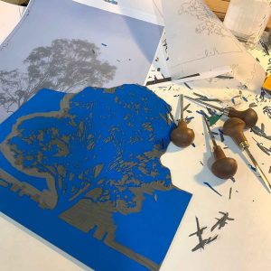 'Still' reduction linocut print, carving the first layer