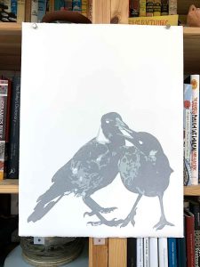 magpies reduction linocut in [rogress for Editions printmaking exhibition