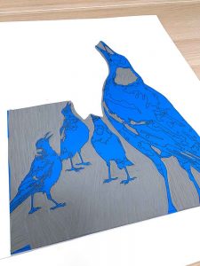Magpie Stories - Family Choir - reduction linocut - lino block