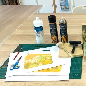 mount paper to wooden panel